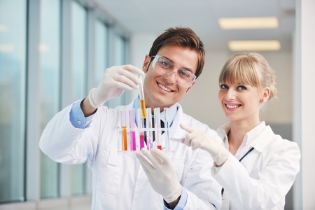 science and research biology chemistry an dmedicine  youn people couple in bright modern  labの写真素材