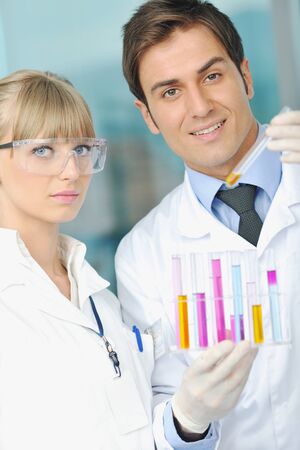 science and research biology chemistry an dmedicine  youn people couple in bright modern  labの写真素材