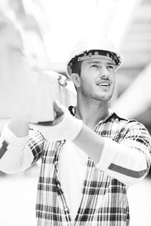 handsome hard worker people portrait at concstruction siteの写真素材