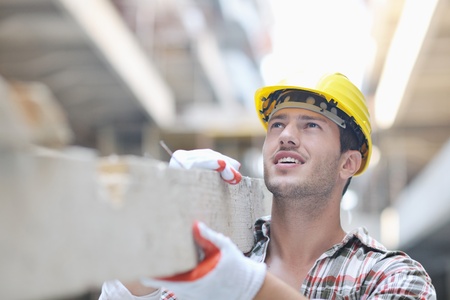 handsome hard worker people portrait at concstruction siteの写真素材