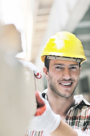 handsome hard worker people portrait at concstruction siteの写真素材