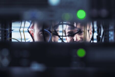 group of young business people it engineer in network server room solving problems and give help and supportの写真素材