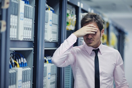 young handsome business man  engeneer in datacenter server roomの写真素材