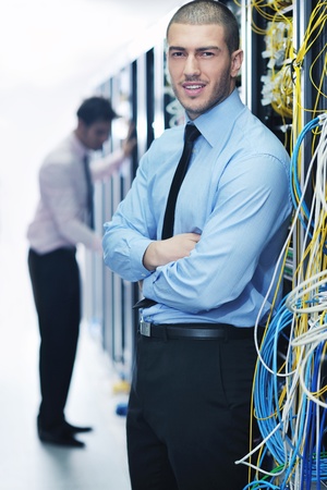 group of young business people it engineer in network server room solving problems and give help and supportの写真素材