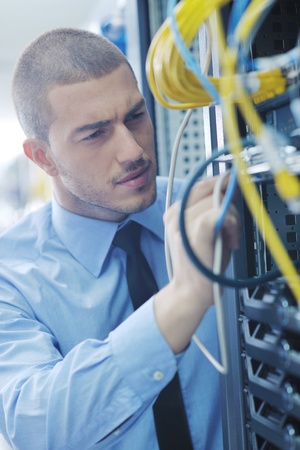 young handsome business man  engeneer in datacenter server roomの写真素材