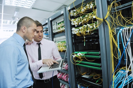 group of young business people it engineer in network server room solving problems and give help and supportの写真素材