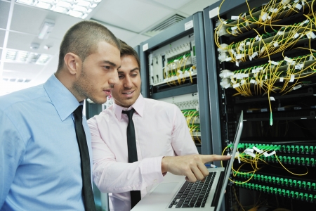 group of young business people it engineer in network server room solving problems and give help and supportの写真素材