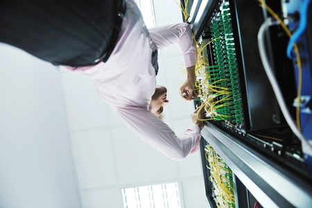 young handsome business man  engeneer in datacenter server room