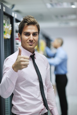 group of young business people it engineer in network server room solving problems and give help and supportの写真素材