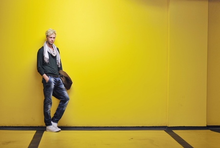 Portrait of an handsome young  man  with urban background and fashion clothes styleの写真素材