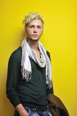 Portrait of an handsome young  man  with urban background and fashion clothes styleの写真素材