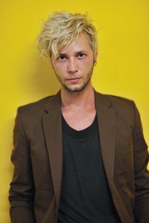 Portrait of an handsome young  man  with urban background and fashion clothes style