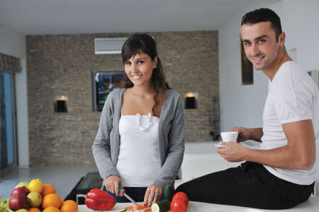 young couple have fun in modern kitchenの写真素材