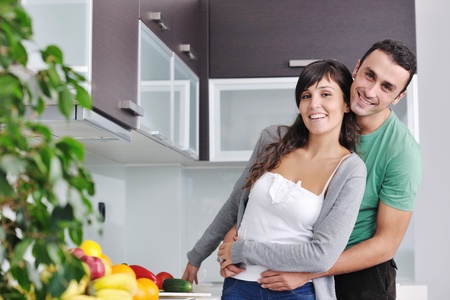young couple have fun in modern kitchenの写真素材