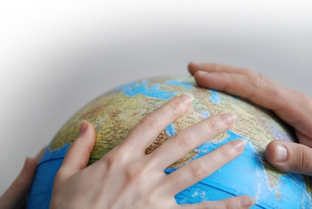 Teamwok concept with hands on globe                             (NIKON D80; 20.3.2007; 1/40 at f/2.8; ISO 400; white balance: Auto; focal length: 50 mm)の写真素材