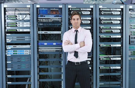young handsome business man  engeneer in datacenter server roomの写真素材