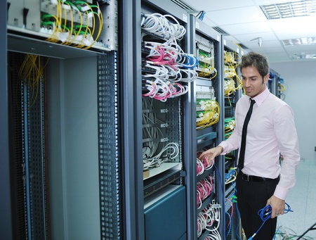 young handsome business man  engineer in datacenter server room