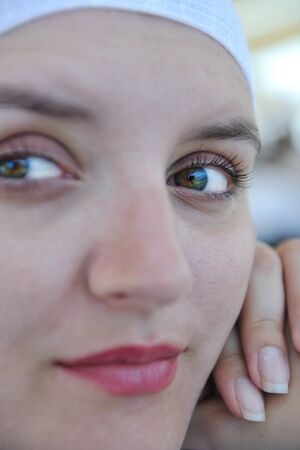 Beautiful young Greek woman in fashion clothes have fun at n the streets of Oia, Santorini, Greeceの写真素材