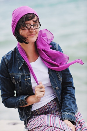 Beautiful young Greek woman in fashion clothes have fun at n the streets of Oia, Santorini, Greeceの写真素材