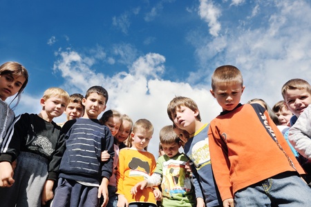 happy child kids group have fun and play at kindergarden preschool education concept with  teacherの写真素材