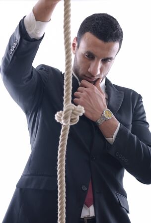 Business man pulling and bond tied with rope concept isolated on white background in studioの写真素材