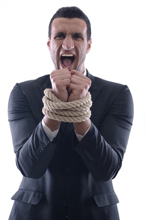 Business man pulling and bond tied with rope  concept  isolated on white background in studioの写真素材