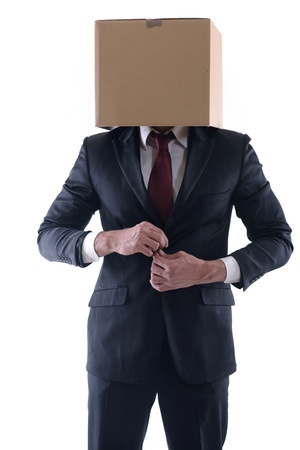 Anonymous business man with a cardboard box on his head concealing his identityの写真素材