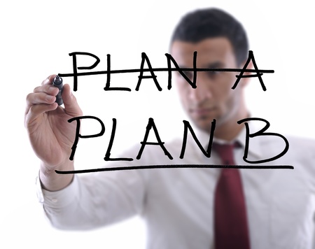 business man draw business solutions and plan b concept  with marker on glass  isolated on white background  in studioの写真素材