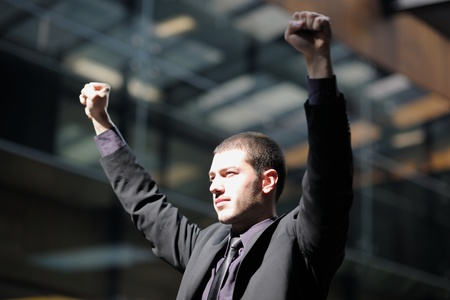 business man spread arms and representing freedom success and winner conceptの写真素材