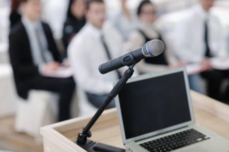 business laptop and microphotone at podium on seminar conference educationの写真素材