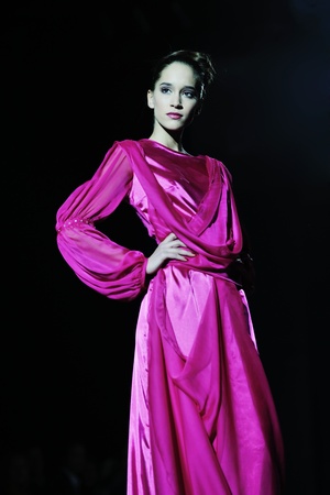 beautiful young fashion model woman walking on  show eventの写真素材