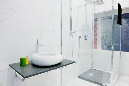 Modern new small bathroom interior with bath tub.の写真素材