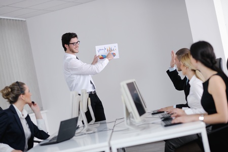 business people group with  headphones giving support in  help desk office to customers, manager giving training and education instructionsの写真素材