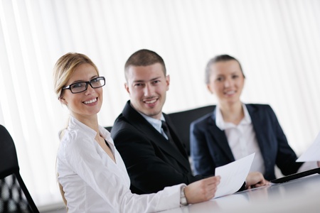 Group of happy young  business people in a meeting at officeの写真素材