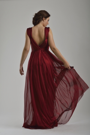 elegant woman in  fashionable  stylish dress posing in the studioの写真素材