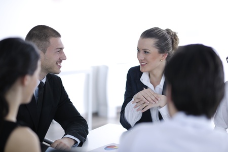 Group of happy young  business people in a meeting at office