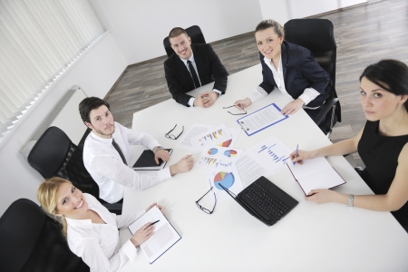 Group of happy young  business people in a meeting at officeの写真素材