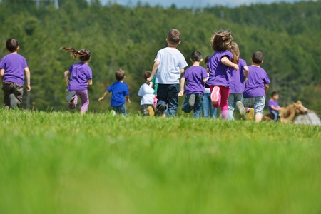 happy kids group have fun in nature outdoors parkの写真素材