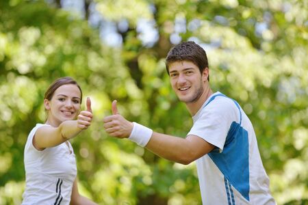 Happy couple riding bicycle outdoors, health lifestyle fun love romance conceptの写真素材