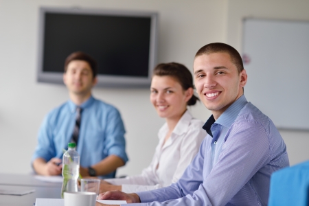 Group of happy young  business people in a meeting at officeの写真素材