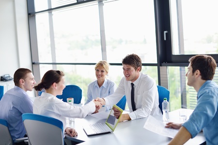 Group of happy young  business people in a meeting at officeの写真素材