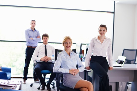 business woman  with her staff,  people group in background at modern bright office indoors