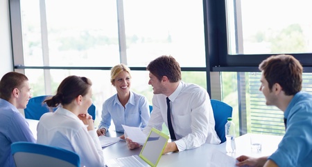 Group of happy young  business people in a meeting at officeの写真素材