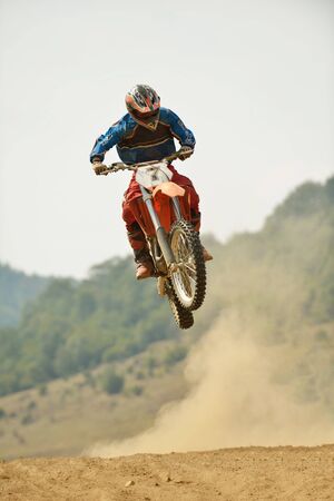 motocross bike in a race representing concept of speed and power in extreme man sportの写真素材