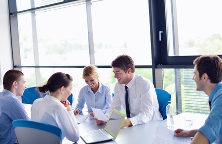 Group of happy young  business people in a meeting at officeの写真素材