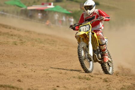 motocross bike in a race representing concept of speed and power in extreme man sportの写真素材