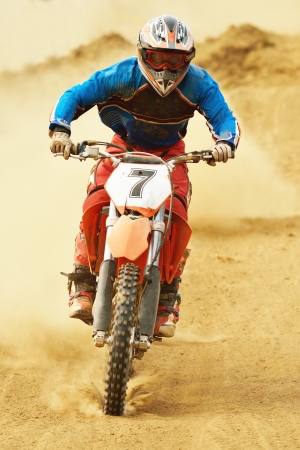 motocross bike in a race representing concept of speed and power in extreme man sportの写真素材