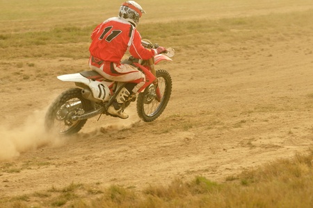 motocross bike in a race representing concept of speed and power in extreme man sportの写真素材