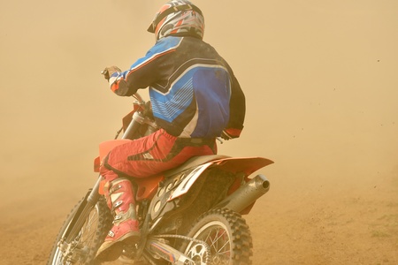 motocross bike in a race representing concept of speed and power in extreme man sportの写真素材