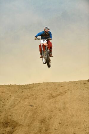 motocross bike in a race representing concept of speed and power in extreme man sportの写真素材
